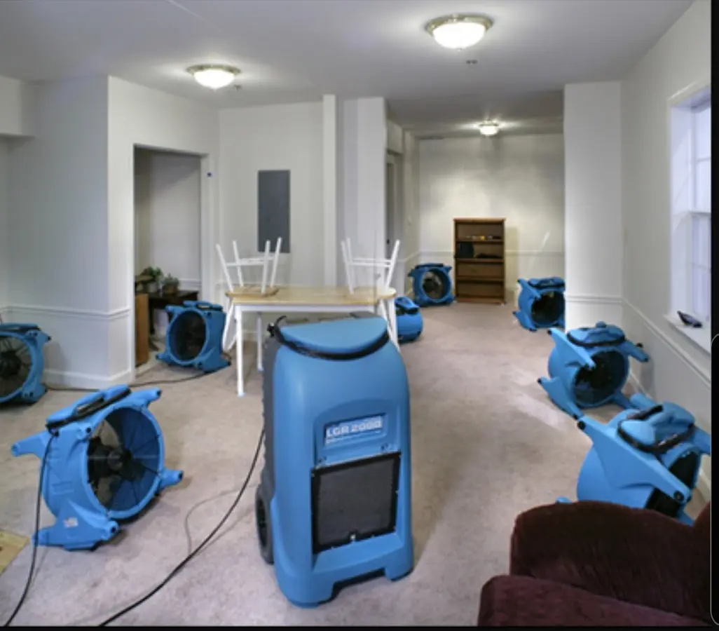 Air movers and dehumidifier setup for Water Damage Restoration in Pittsford